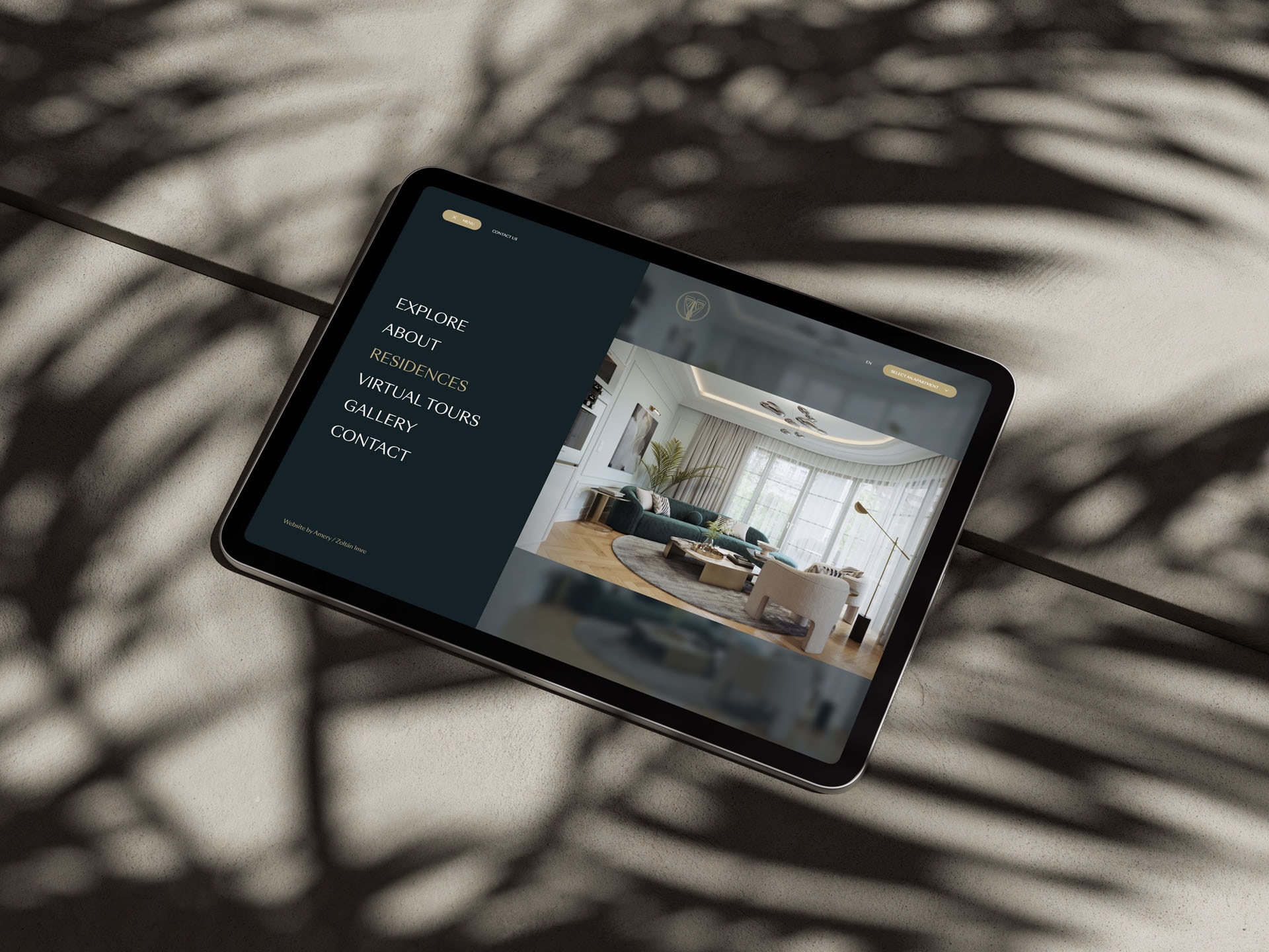 Amery Residence website navigation menu on a tablet lying in palm-leaf shadows, UI design