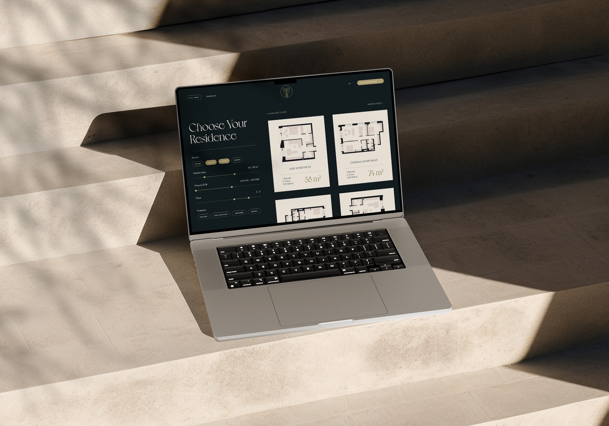 Amery Residence floor-plan selector on a laptop in sunlight, UI design